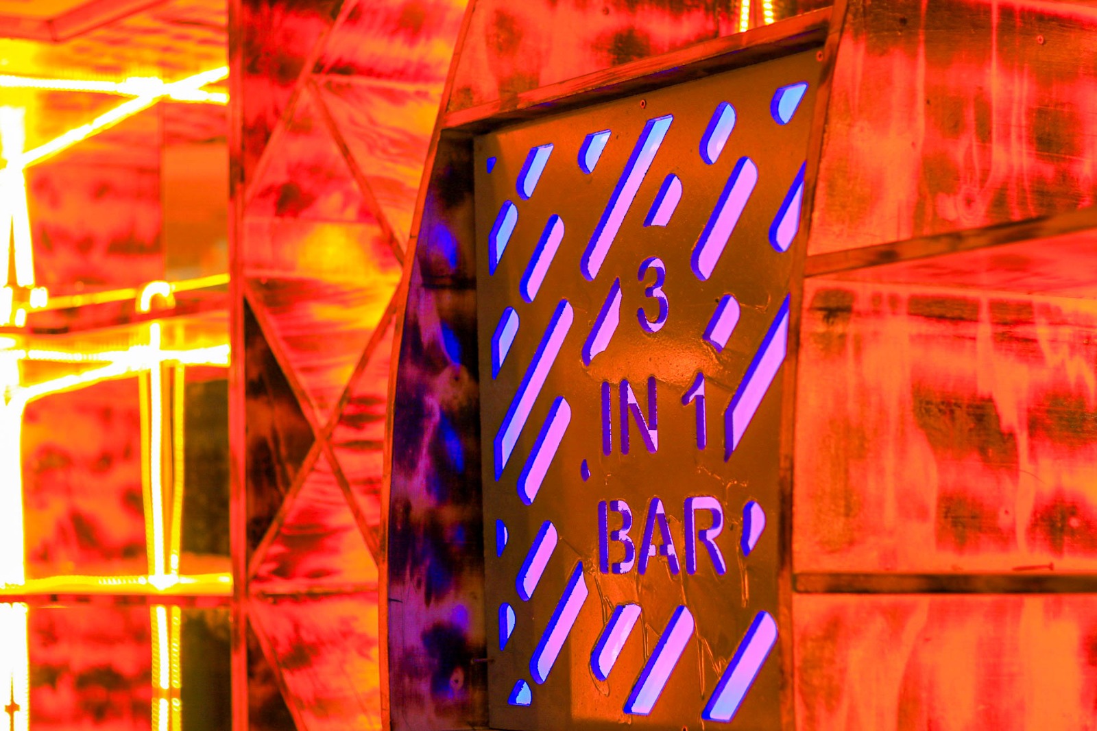 Three In One Bar and its illuminated interior signage